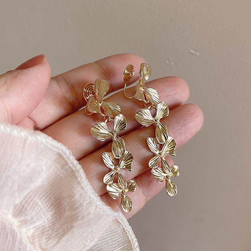 

Mild Luxury Retro 925 Silver Ear Jewelry Female Lilac Mosquito coil ear clip a pair