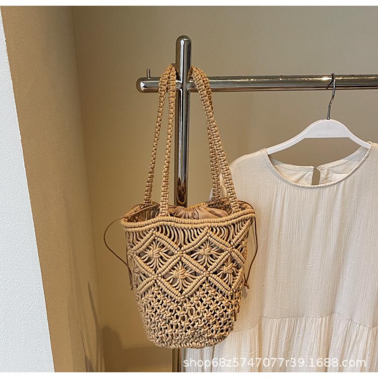 

Literary and simple cotton thread shoulder woven bag women s 2025 new hollow niche handmade straw bag handbag women хаки