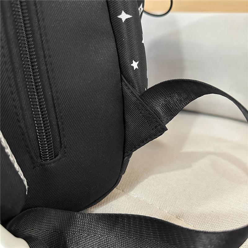 Cute Star Print Nylon Backpack for Women – Fashionable School & Daily Use Bag with Front Drawstring Pocket and Plush Charm