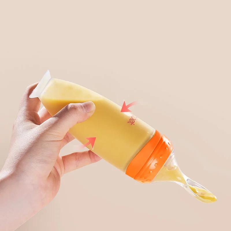 Squeezing Feeding Bottle Baby Spoon and Baby Bib a Set Baby Training Rice Cereal Food Spoon Supplement Feeder Safe Useful