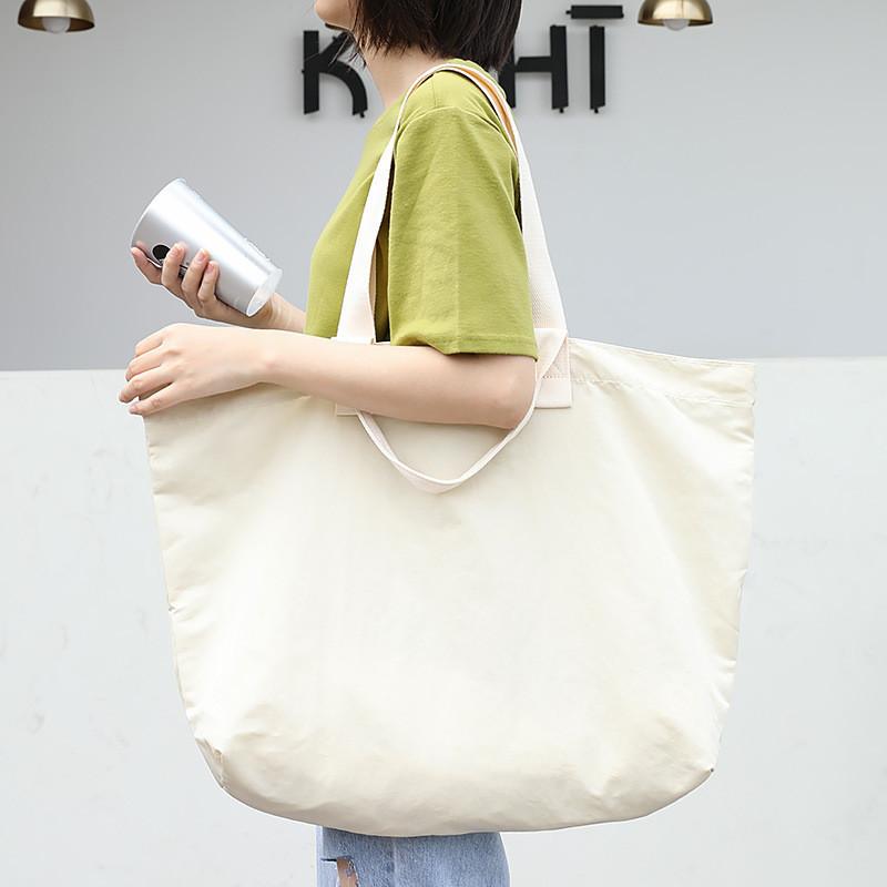 IELGY Korean version of casual large-capacity nylon handbag, simple literary Mori canvas bag