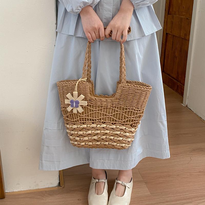 Handwoven Natural Fiber Tote Bag with Braided Handles and Open Weave Design