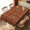 Warm brown checkered tablecloth creates a cozy dining atmosphere