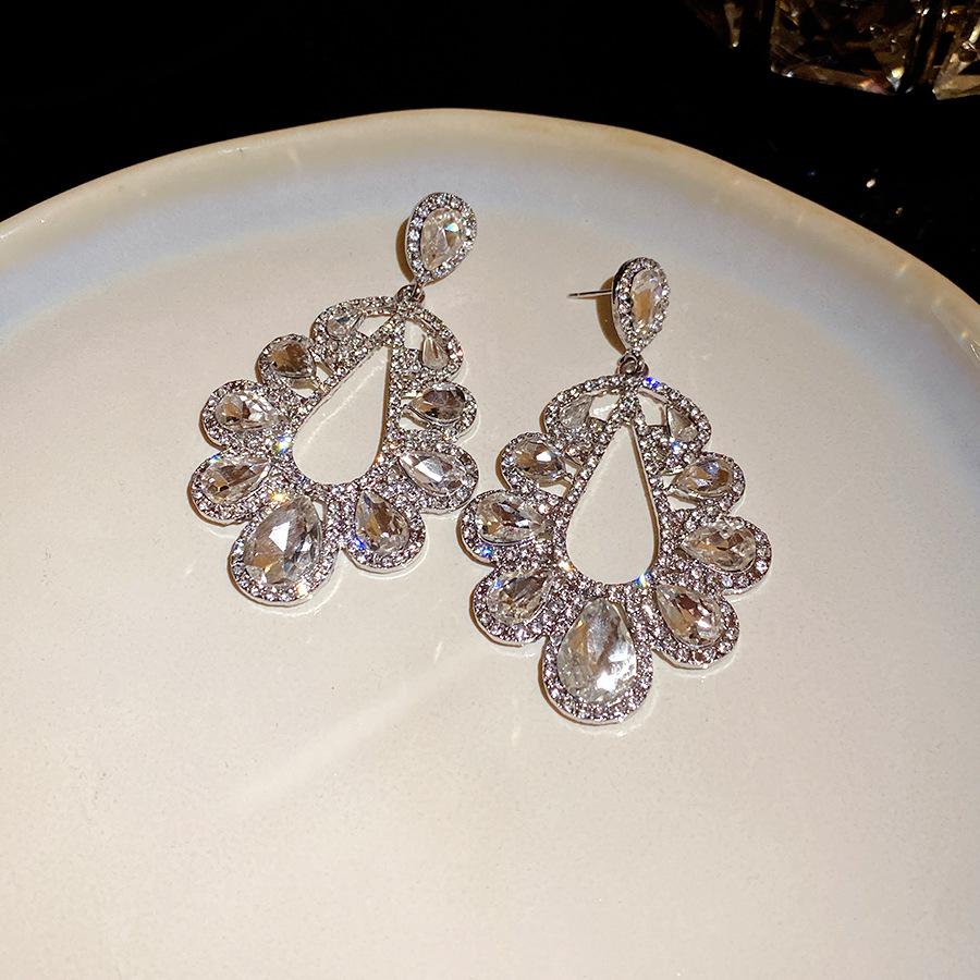 Silver needle super flash diamond-set water drop hollow earrings fashion temperament exquisite earrings light luxury high-end earrings women