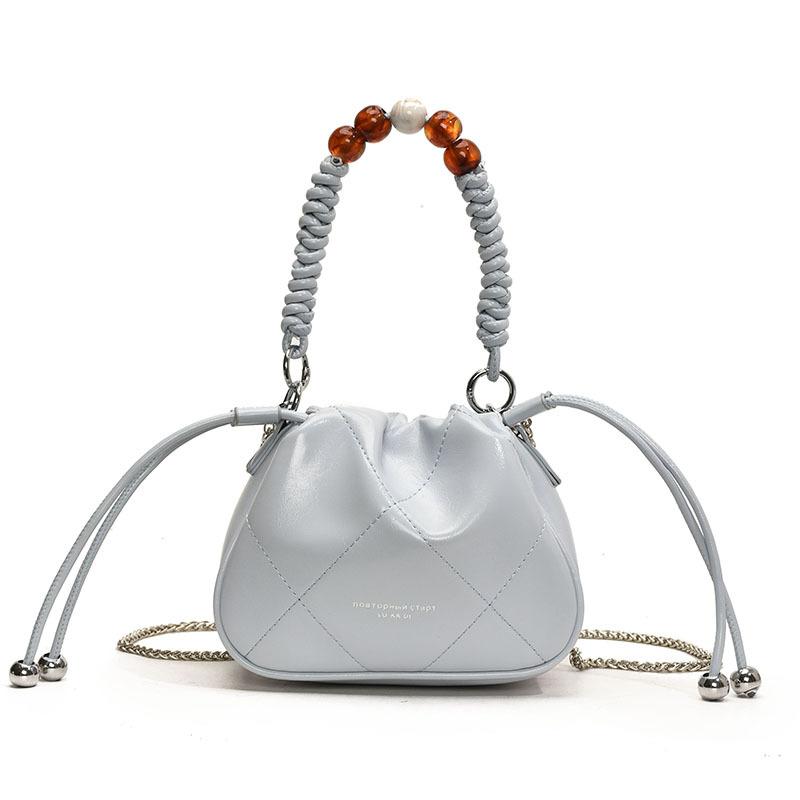 

2025 early spring new Korean niche design foreign style portable bucket bag fashion commuter versatile messenger bag women світло-синій колір