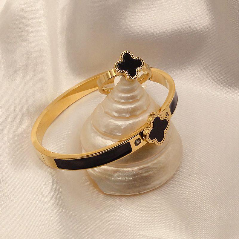 

Комплект из браслета и кольца с четырехлистным клевером: Титановая сталь, масляный алмаз, доступен в черном, белом, красном и зеленом цветах