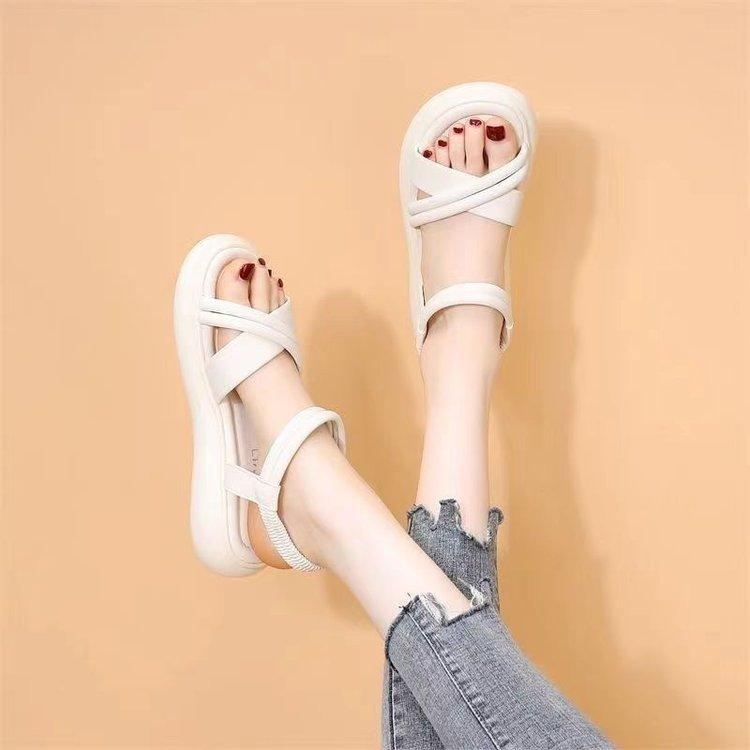

Сандалии женские лето 2024 новые односложные ремешки не устают ноги плоские туфли крест римские туфли нишевые пляжные сандалии 35 белый