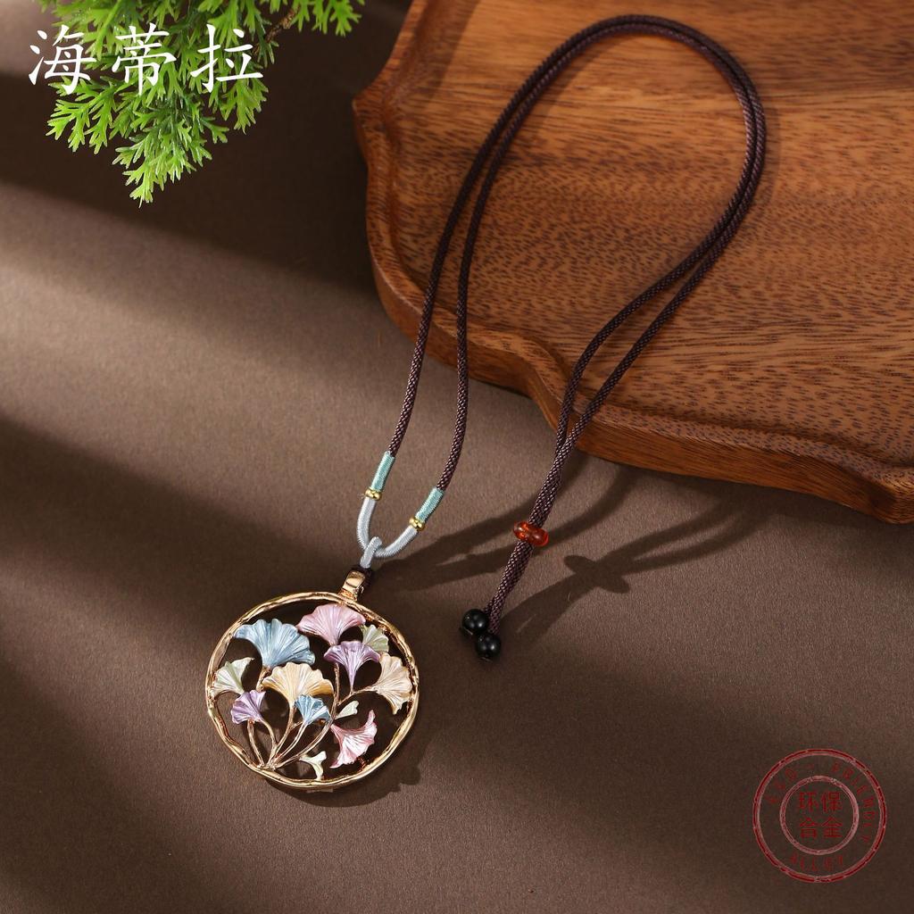 New round hollow color painting oil ginkgo biloba braided rope long pendant women's autumn and winter retro long necklace