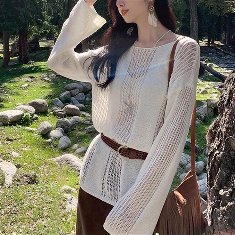 Spring and summer one-word collar design sense hollow long-sleeved knitted sweater women's thin loose lazy blouse high-end top