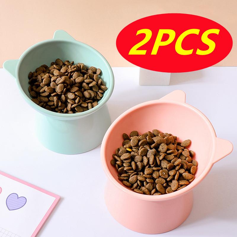 

Новая миска для кошек 2PCS Миска для собак с высокими ногами 45 ° Защита шеи Миска для воды для корма для домашних животных Анти-опрокидывающаяся бинауральная кормушка для кормления домашних животных