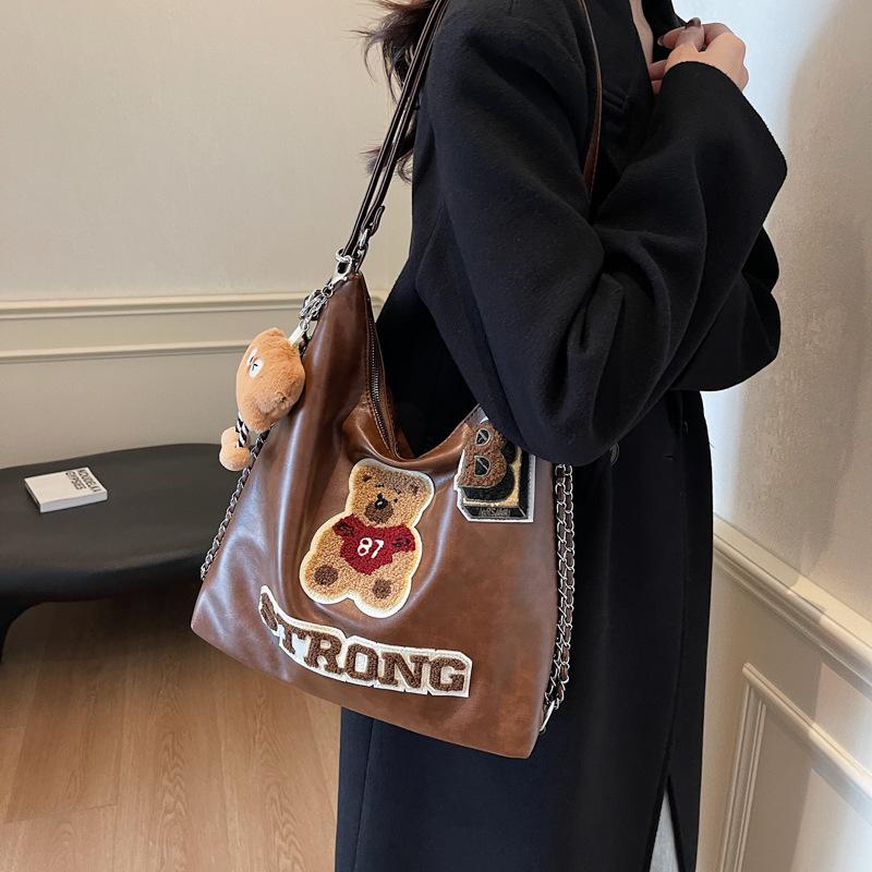 Fashion and leisure large-capacity backpack women's 2025 new spring and summer cartoon embroidery high-end niche design