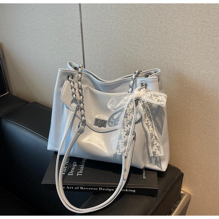 

Premium sense bag women s large capacity 2025 new spring and summer versatile chain messenger bag casual tote bag синій