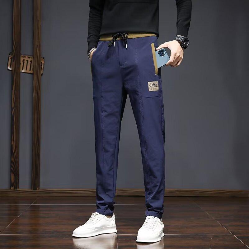 

Casual long pants men s new spring and summer nine-point sweatpants loose trend versatile trousers 5XL синий