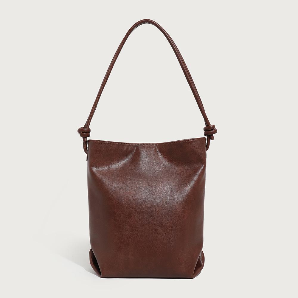 

2025 новая ретро легкая сумка универсальная сумка-ведро большая вместительная сумка сумка для поездок на работу сумка через плечо ретро женская сумка темно-коричневого