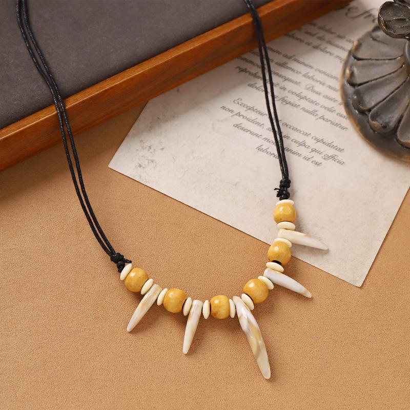 Hand-woven imitation wolf tooth wood bead necklace, retro niche dog tooth tribe men's and women's personalized sweater accessories