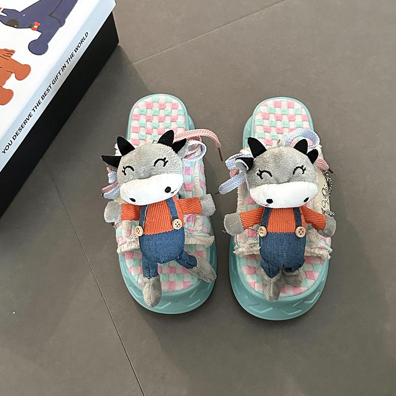Cartoon doll thick-soled one-word slippers female summer design sense cute fringed beach shoes flat-soled semi-drag cool slippers