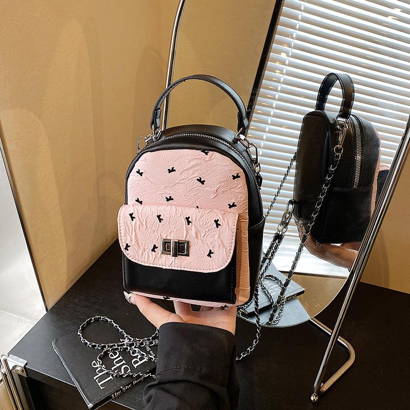 

Fashion and popular women s backpack 2025 new chain mini versatile backpack contrasting color portable small schoolbag рожевий