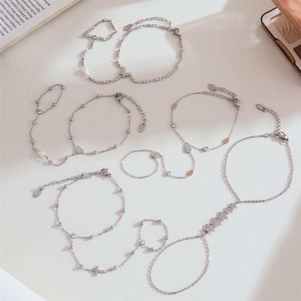 Jemný řetízek na ruku z nerezové oceli pozlacený 18k zlatem s kubickými zirkony Lesklé zirkonové řetízky na ruku pro ženy