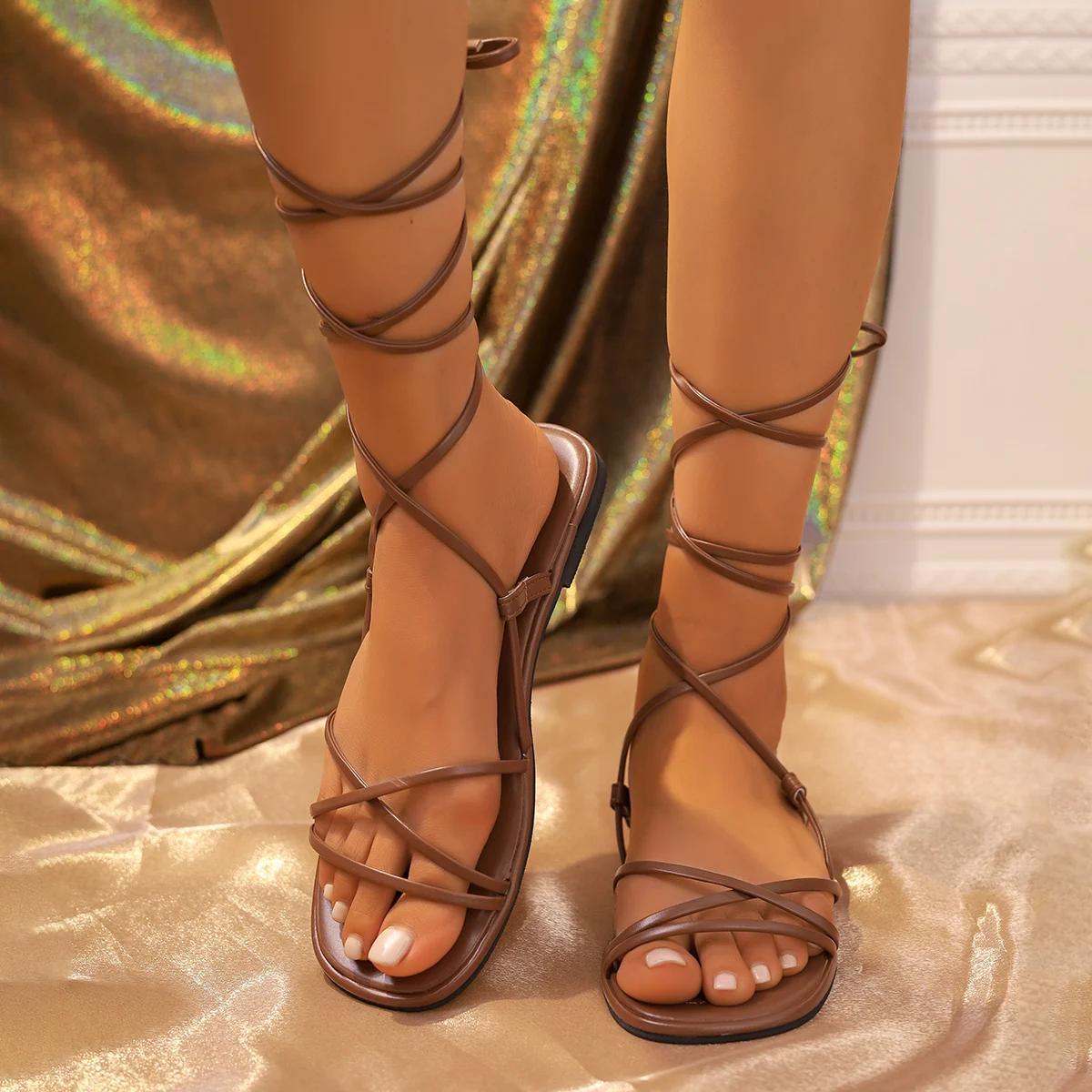 

Модные сандалии женские летние новинки 2024 года, пляжная мода, сексуальные плоские повседневные туфли с открытым носком и перекрестными шнурками, узкие туфли в стиле феи, черные римские сандалии 41 темно-коричневого