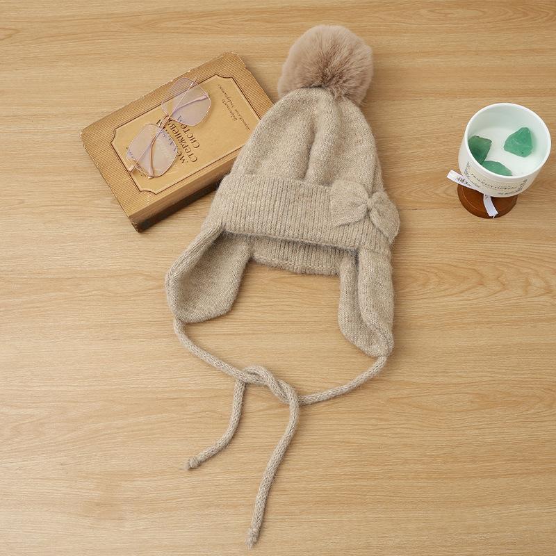 Hat women's autumn and winter cute hairball knitted wool hat thickened ear protection warm fashionable versatile