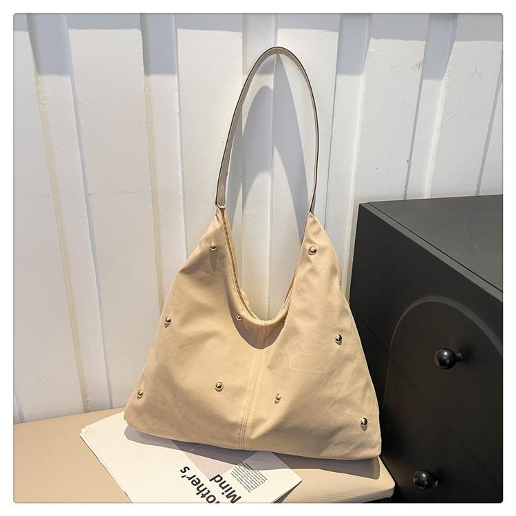 

Сумка-выделение женская 2025 новая портативная сумка на плечо сумка-тоут большой вместимости универсальная сумочка взрыв бежевый