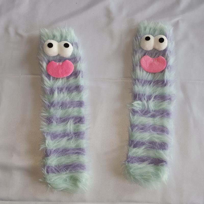 A pair of ugly cute funny socks women's medium tube socks autumn and winter floor sleeping socks coral fleece home hair fluffy c