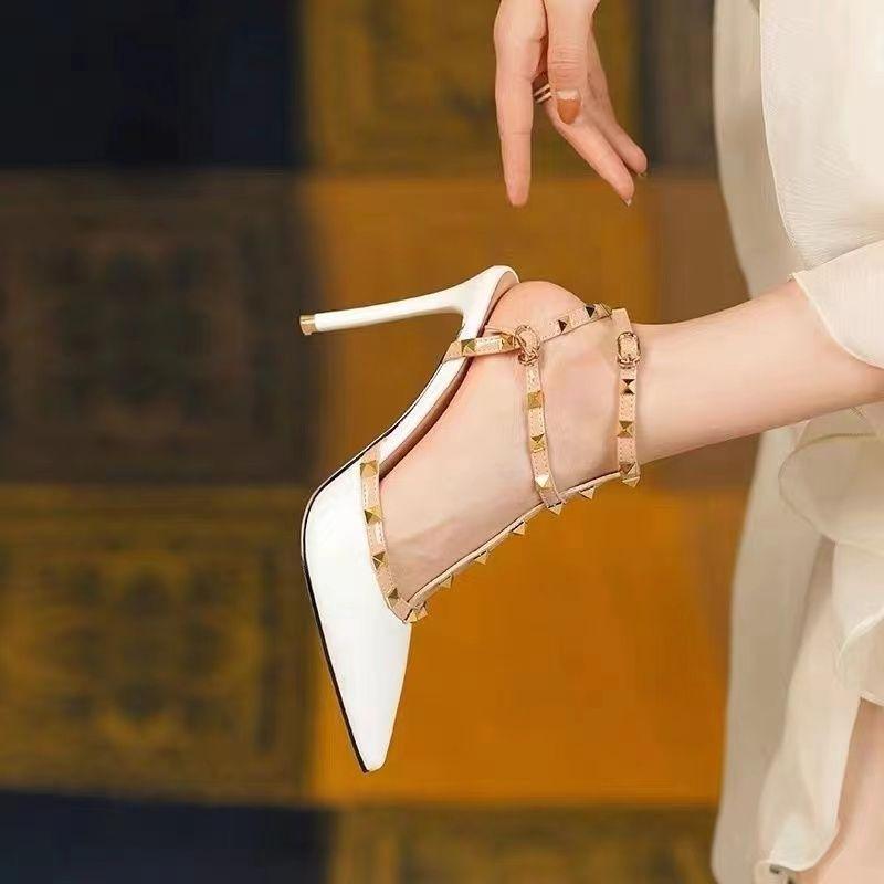 High heels women's 2025 spring new French one-word buckle rivet shoes pure desire Internet celebrity large size sandals pointed single shoes