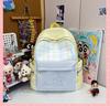 Schoolbag New Japanese plaid schoolbag for women, junior high school students Large capacity, light and wear-resistant cute cartoon backpack