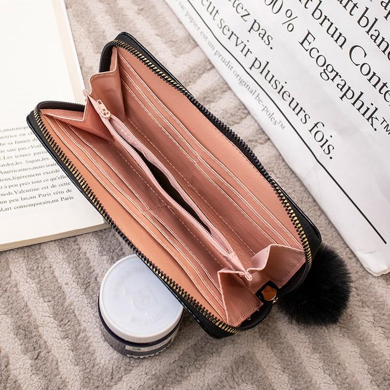 New solid color butterfly label wallet women's long zipper clutch bag hairball simple change bag one piece hair