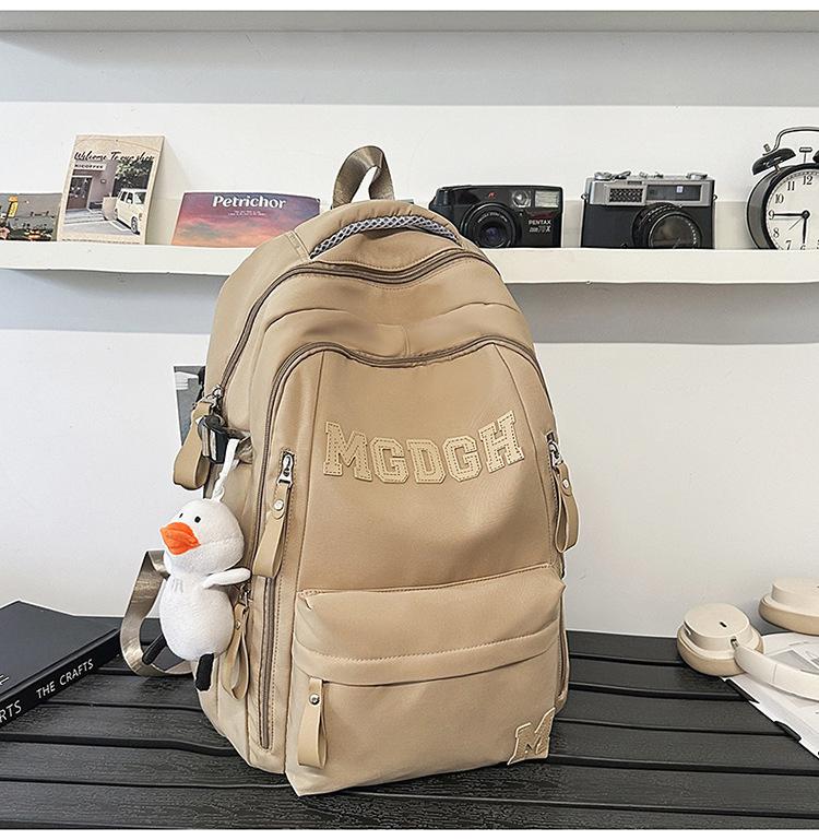 School bag, large capacity, multi-layer, junior high school boys and girls, backpack, burden reduction, spine protection, lightweight