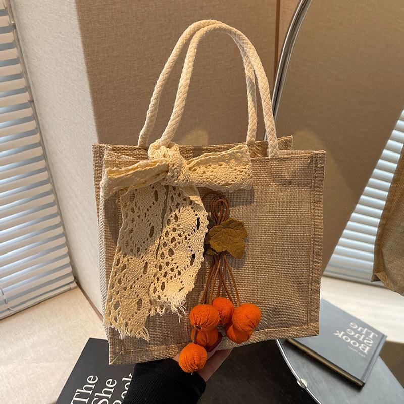 

Summer lunch box bag women 2025 new Korean version shoulder small satchel women ins fashion out portable tote bag
