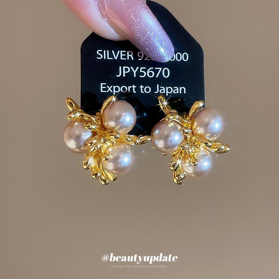 New French Retro Metal Fireworks Pearl Stud Earrings Femininity Light Luxury Versatile Elegant Earrings Wholesale