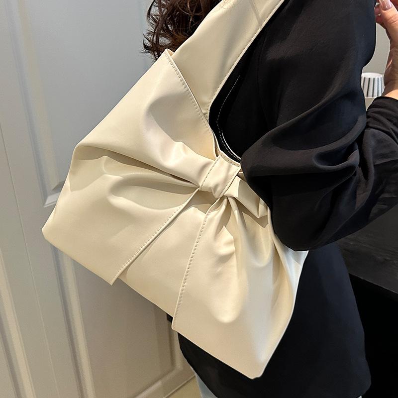 Korean version of casual underarm women's bag 2025 new simple bow design sense tote bag simple portable shoulder bag