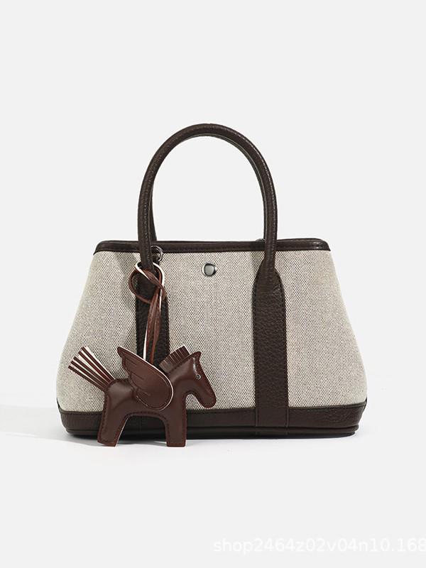 Niche Luxury Canvas Mini Garden Handbag: Stylish, Versatile Crossbody for Women
