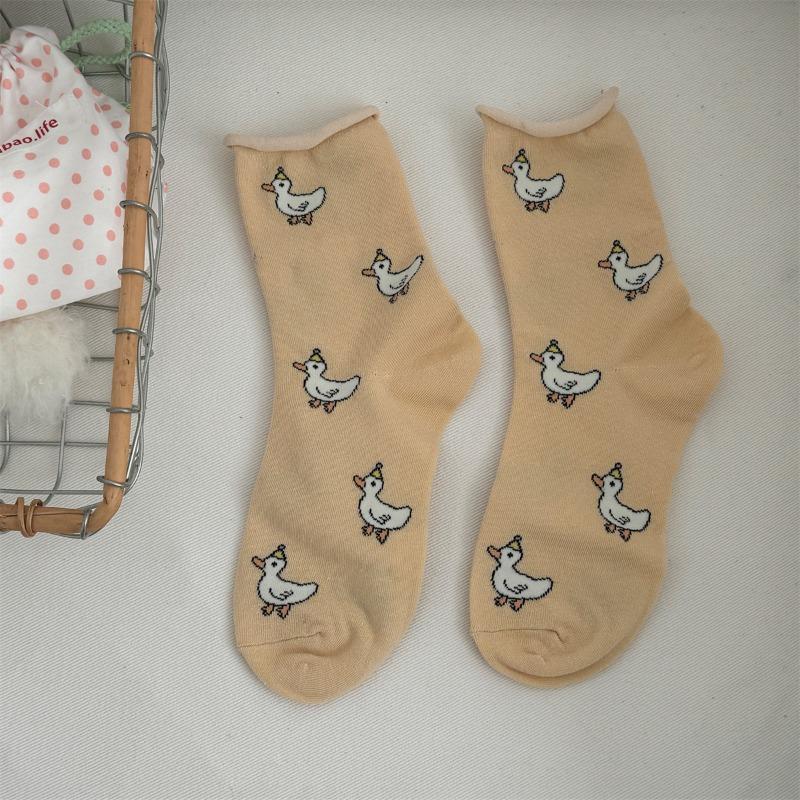 

Свернутые носки полностью напечатаны мультяшными рисунками. Милые гольфы для девочек можно носить круглый год 1 pair жёлтый/абрикосовый