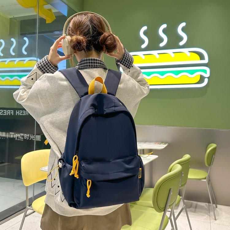 Schoolbag Korean version ins Large capacity solid color campus simple and lightweight versatile letter schoolbag 3rd to 6th grade students shoulder
