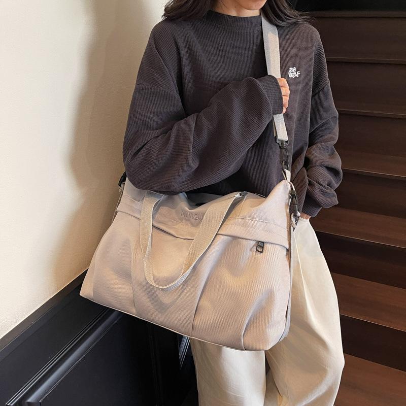 High-value short-distance travel bag women's new trendy and textured business trip duffel bag simple large-capacity sports fitness bag