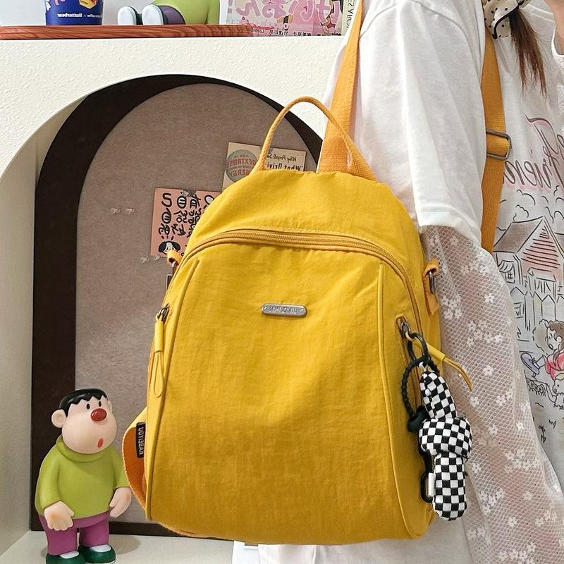 Versatile solid color women's backpack large-capacity leisure bag simple backpack light schoolbag light luxury student bag commuter bag