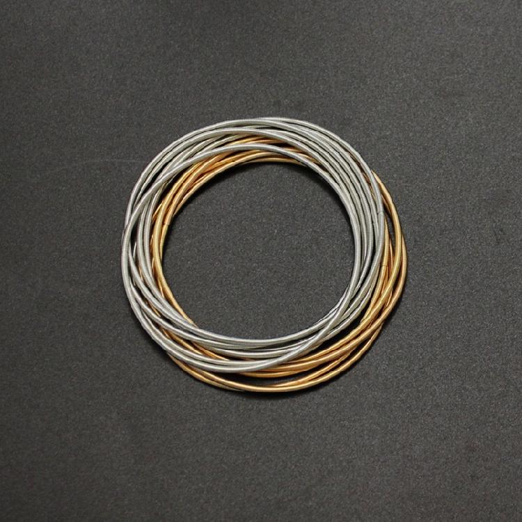 Infällbar Armband Kolstål Trådarmband Smycken Fjäderarmband Spolset