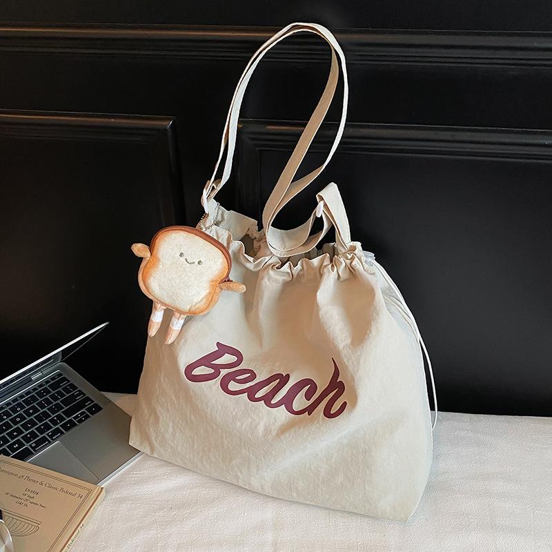 

New letter simple drawstring shoulder cloth bag women, large capacity drawstring portable tote bag make-up bag Without pendant білий