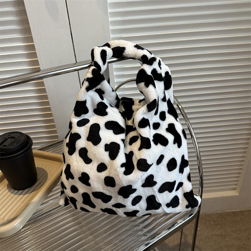 2025 Early Spring New Large Capacity Plush Trend Cow Pattern Personality Student Class Shoulder Bag Female Design Sense
