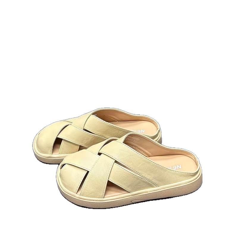 Woven French bag head slippers women's 2025 summer new flat bottom hollow fashion high sense with skirt cool slippers