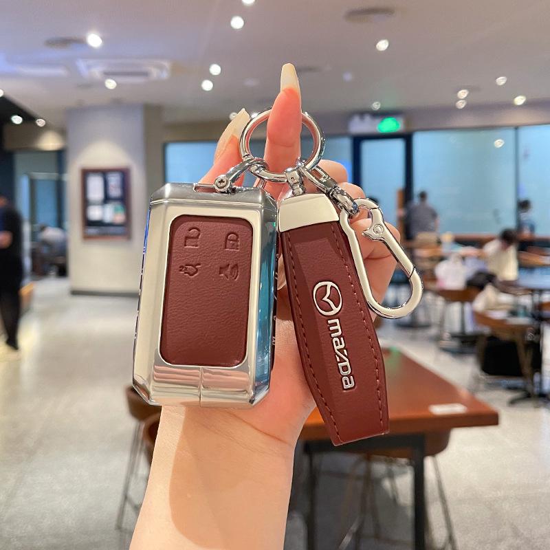 Kuooo: Durable, Fully Enclosed Cover with Buckle for Mazda EZ6 Key Fobs and EZ60 Car Remotes.