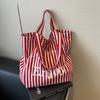 Striped canvas shoulder bag with letter design  large capacity casual tote  minimalist and versatile