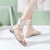 Rhinestone Serpentine Winding Sandals Female Flat Bottom One Word with Low Heel Explosion 2025 New Fairy Wind Roman Crystal Shoes