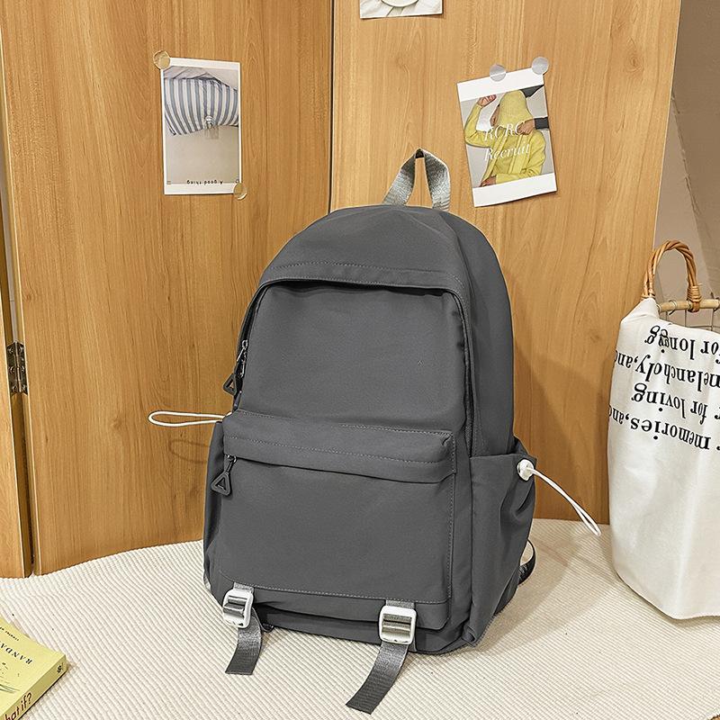 Schoolbag1011 new versatile black schoolbag male college student large capacity backpack female junior high school girl solid color backpack