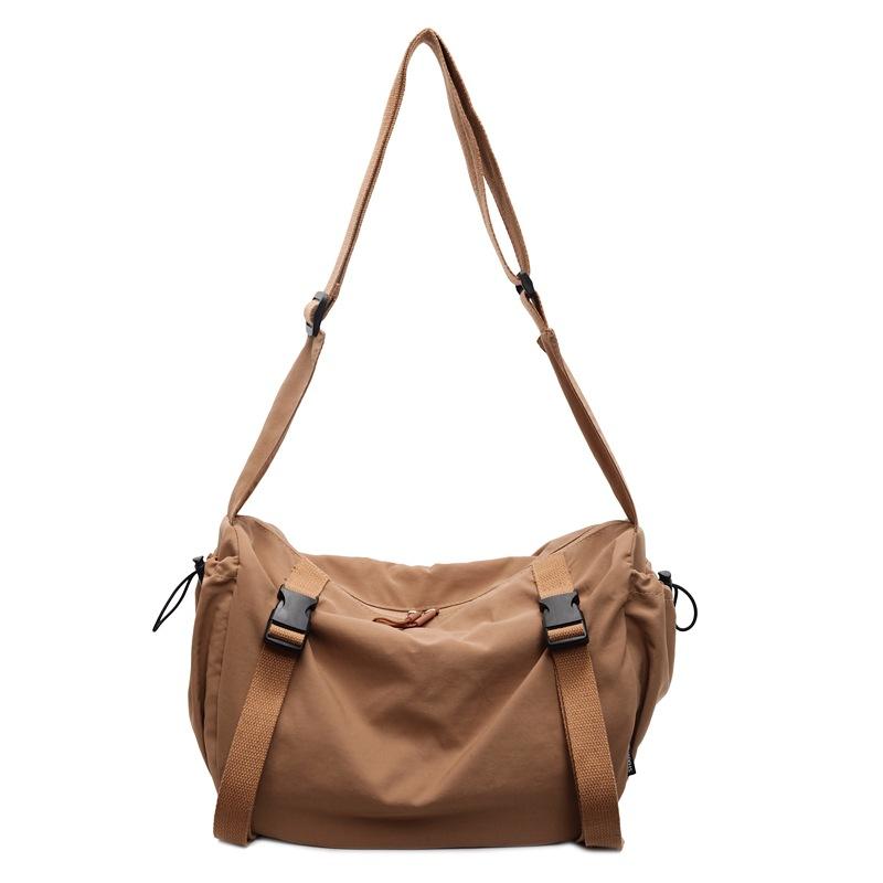 Niche design simple solid color 2025 casual spring fashion lazy style casual female college student messenger tote bag