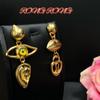 European, American and Western Xiapa, devil's eye, ears, mouth, facial features, expression asymmetry, earrings, medieval vintage earrings