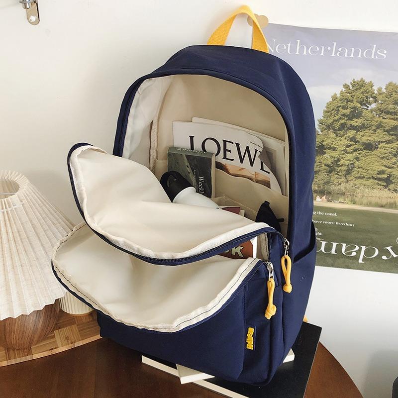 New High-value Solid Color Simple Letter Backpack Couple Casual Lightweight Large-capacity Backpack