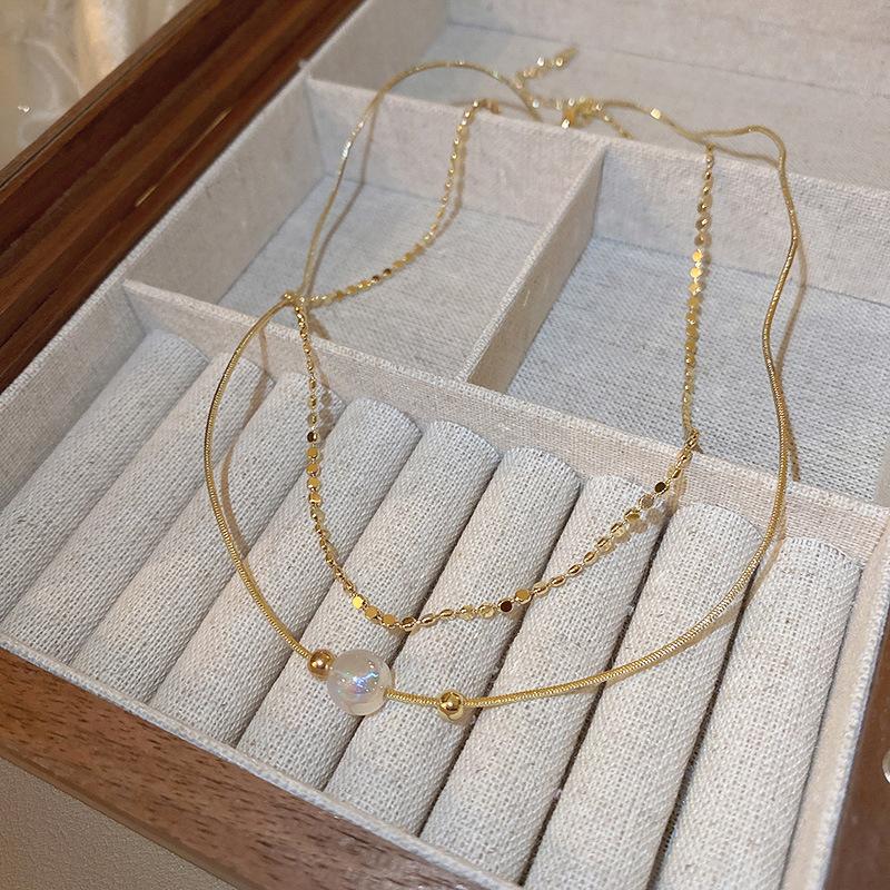 Fashion versatile color matching pearl necklace retro niche high-end sense collarbone chain personality light luxury design sense necklace women